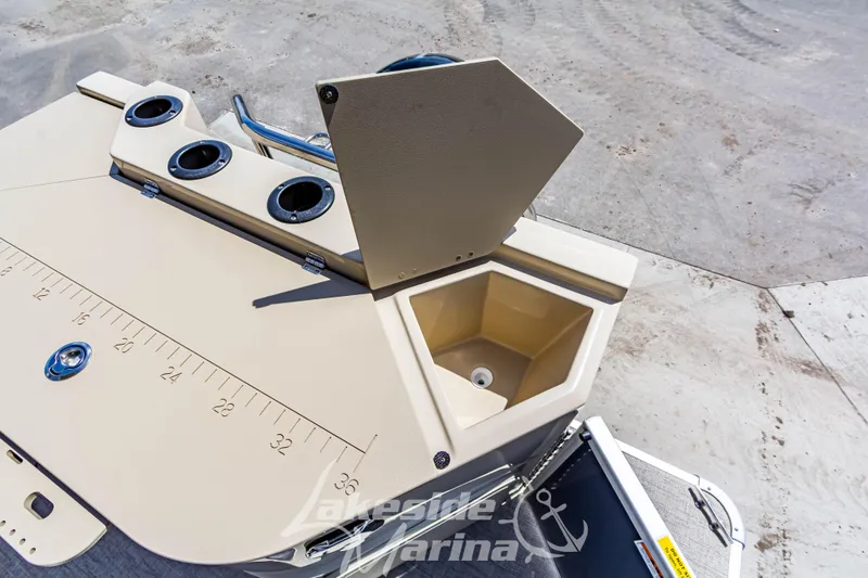 Slide: The Image of 2025 Godfrey Sweetwater 2286 FSX boat deck with cup holders and measuring scale. - 30