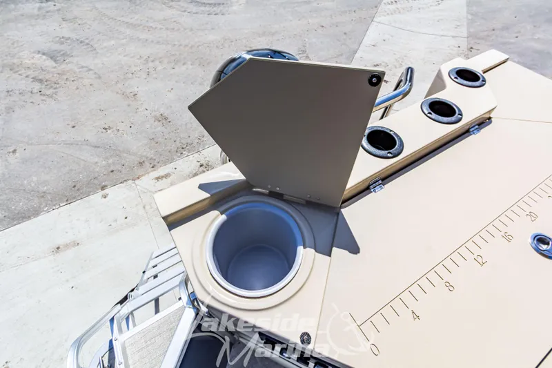 Slide: The Image of 2025 Godfrey Sweetwater 2286 FSX boat with open storage compartment and cup holders. - 33