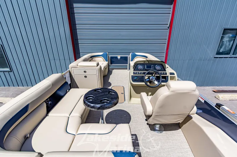 Slide: The Image of 2025 Godfrey Sweetwater 2286 FSX pontoon boat interior with helm and seating area. - 37