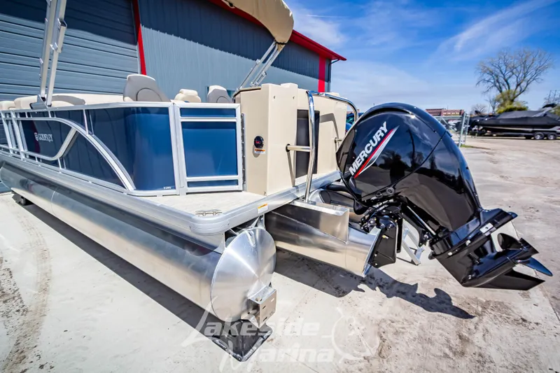 Slide: The Image of 2025 Godfrey Sweetwater 2286 FSX pontoon boat with Mercury outboard motor, docked outdoors. - 4