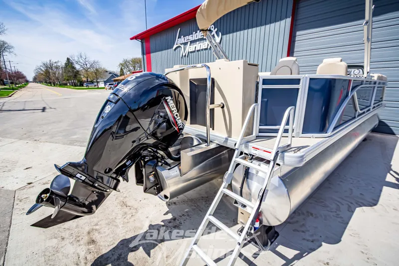 Slide: The Image of 2025 Godfrey Sweetwater 2286 FSX pontoon boat with Mercury outboard motor at marina. - 6