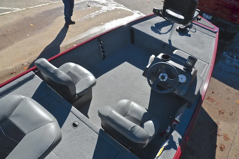 Slide: The Image of 2023 Bass Tracker Classic boat interior with steering wheel and seating. - 21