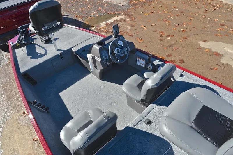Slide: The Image of 2023 Bass Tracker Classic boat interior with gray seating and steering console. - 22