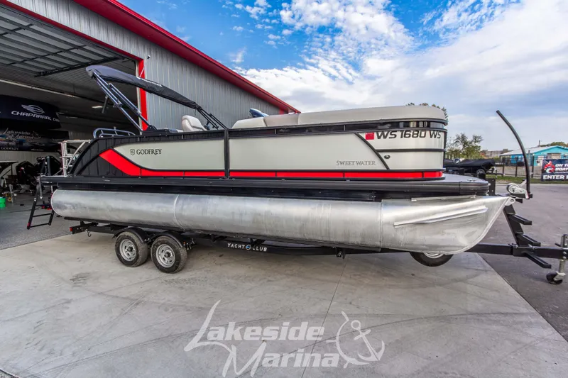 The Image of 2025 Godfrey Sweetwater 2286 SFL pontoon boat on trailer at Lakeside Marina. - 1