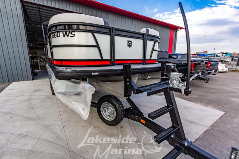 Slide: The Image of 2025 Godfrey Sweetwater 2286 SFL pontoon boat on trailer at Lakeside Marina. - 11