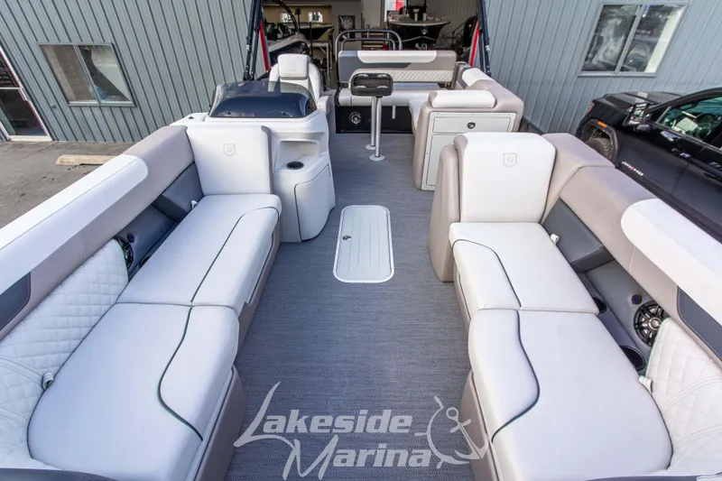 Slide: The Image of 2025 Godfrey Sweetwater 2286 SFL pontoon boat interior with spacious seating at Lakeside Marina. - 12