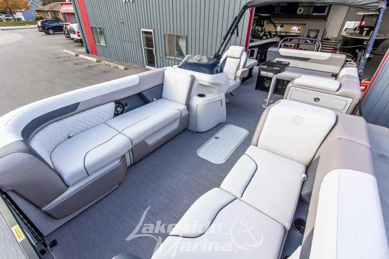Slide: The Image of 2025 Godfrey Sweetwater 2286 SFL pontoon boat interior with luxurious seating and modern design. - 13