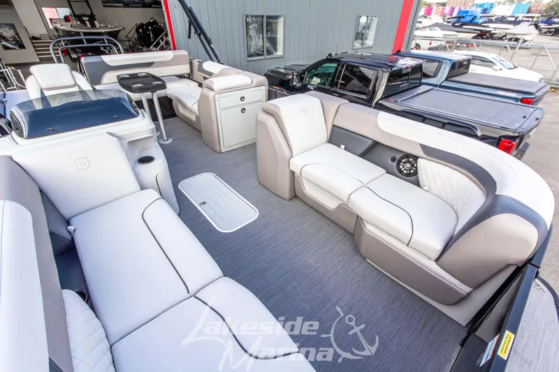 Slide: The Image of 2025 Godfrey Sweetwater 2286 SFL pontoon boat interior with luxurious seating and modern design. - 14