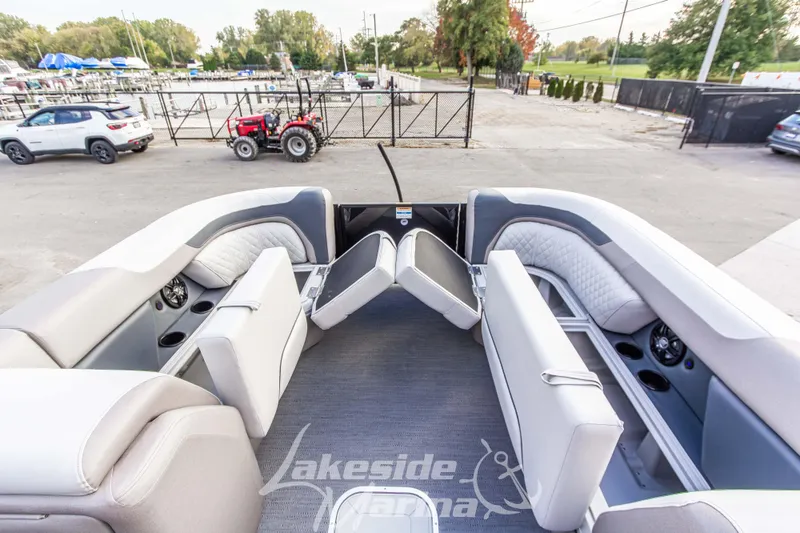 Slide: The Image of 2025 Godfrey Sweetwater 2286 SFL pontoon boat interior with plush seating and modern design. - 16