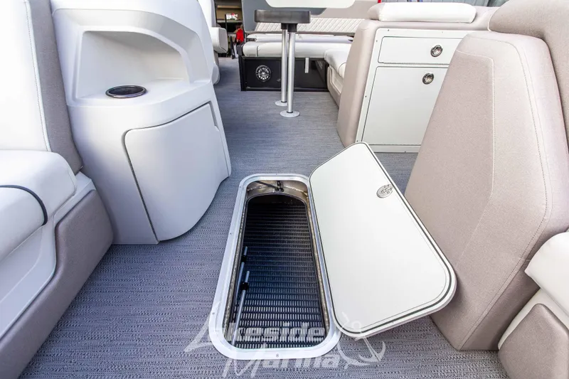 Slide: The Image of Interior of 2025 Godfrey Sweetwater 2286 SFL boat with open storage compartment. - 17
