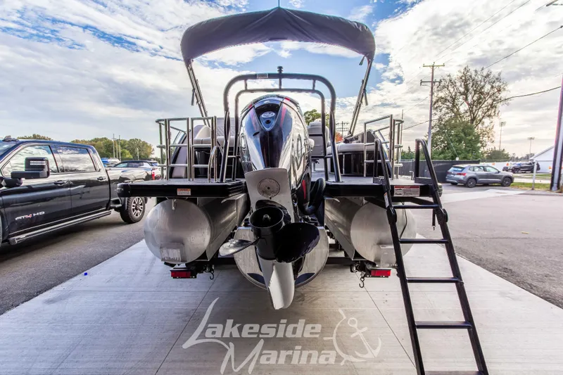Slide: The Image of 2025 Godfrey Sweetwater 2286 SFL pontoon boat at Lakeside Marina, rear view. - 5