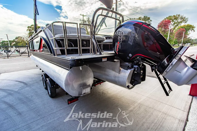 Slide: The Image of 2025 Godfrey Sweetwater 2286 SFL pontoon boat with powerful outboard motor at Lakeside Marina. - 6