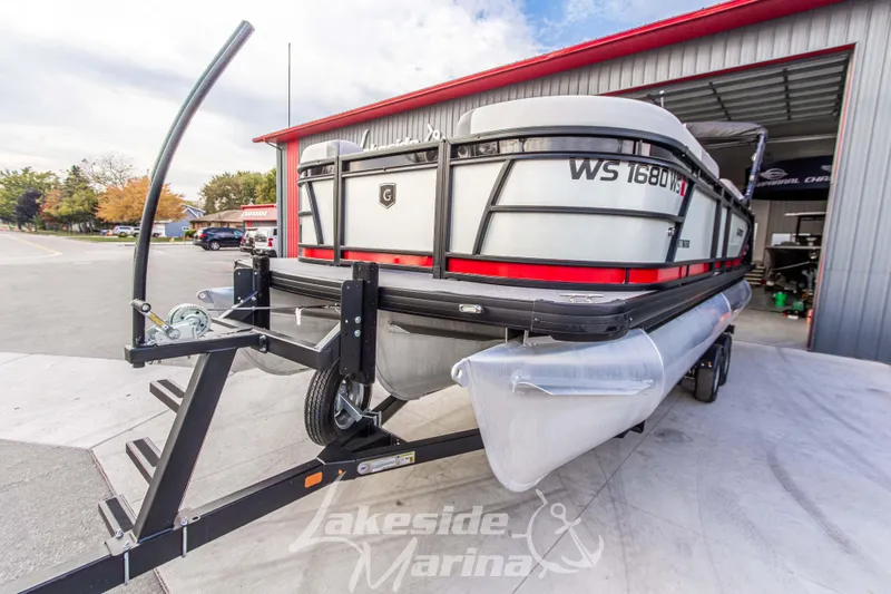 Slide: The Image of 2025 Godfrey Sweetwater 2286 SFL pontoon boat on trailer at Lakeside Marina. - 9