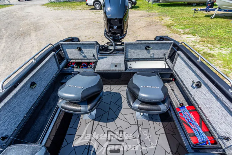 Slide: The Image of 2025 Recon 2185 DC boat interior with two seats and storage compartments. - 13