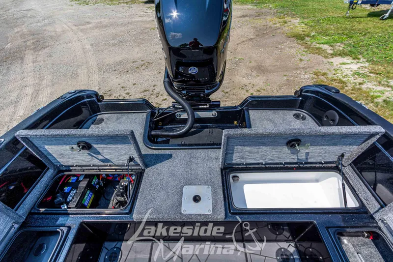 Slide: The Image of 2025 Recon 2185 DC boat interior with open storage compartments at Lakeside Marina. - 14