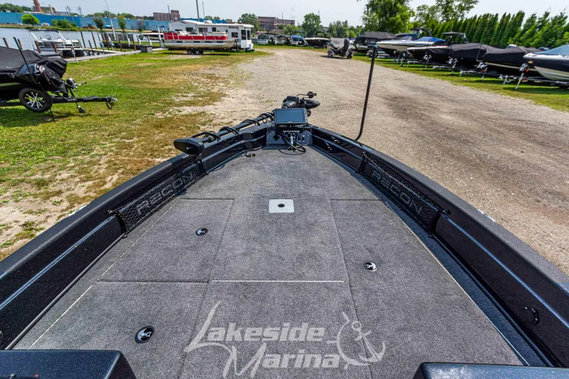 Slide: The Image of 2025 Recon 2185 DC boat at Lakeside Marina, showcasing spacious deck and modern design. - 28