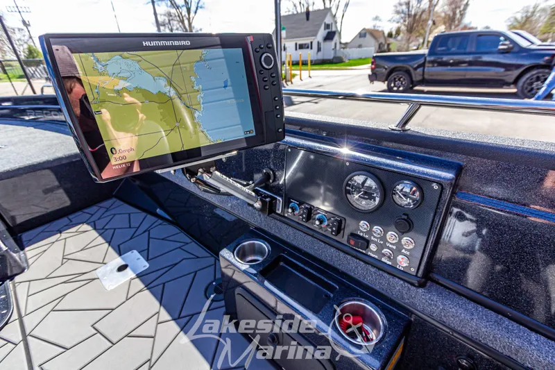 Slide: The Image of Dashboard of 2025 Recon 895 Tiller boat with navigation system and controls. - 16