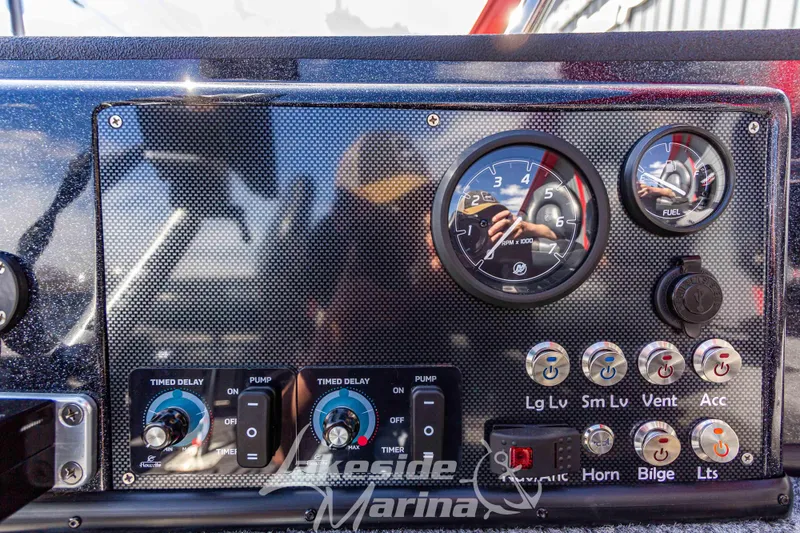 Slide: The Image of Control panel of 2025 Recon 895 Tiller with gauges and switches. - 18