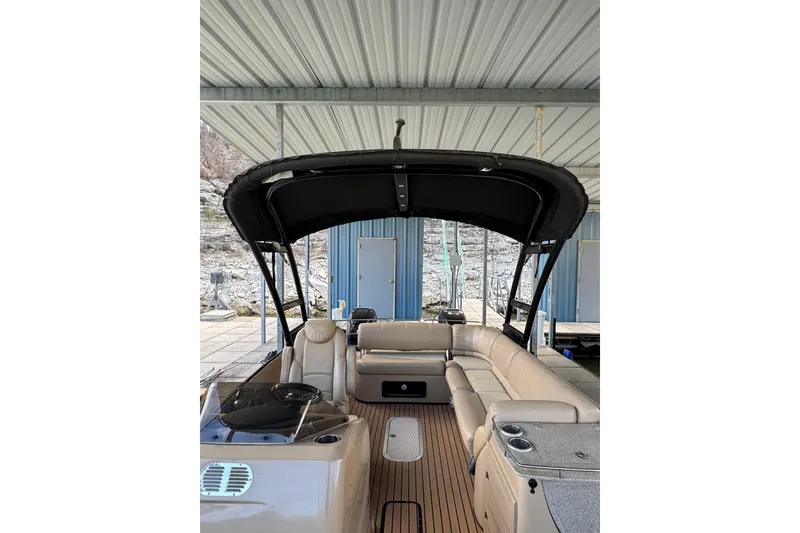 Slide: The Image of 2016 Harris Grand Mariner SL 250 Twin Engine pontoon boat with beige seating and black canopy. - 11
