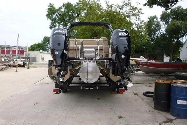 Slide: The Image of 2016 Harris Grand Mariner SL 250 Twin Engine boat with dual 300 horsepower motors. - 2