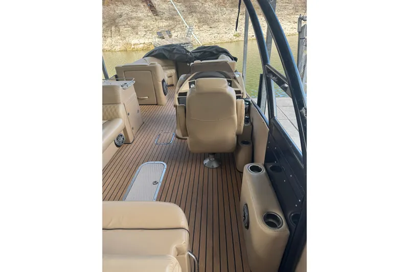 Slide: The Image of 2016 Harris Grand Mariner SL 250 Twin Engine interior with beige seating and wood flooring. - 3