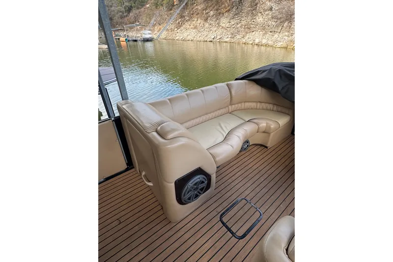 Slide: The Image of Luxurious seating on 2016 Harris Grand Mariner SL 250 pontoon boat, overlooking serene water. - 7