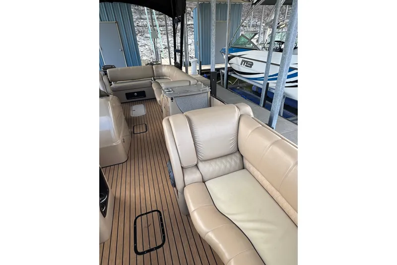 Slide: The Image of 2016 Harris Grand Mariner SL 250 Twin Engine interior with beige seating and wood flooring. - 9