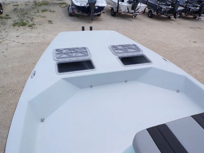Slide: The Image of 2026 Shoalwater 20' Catamaran with open storage compartments on deck. - 19