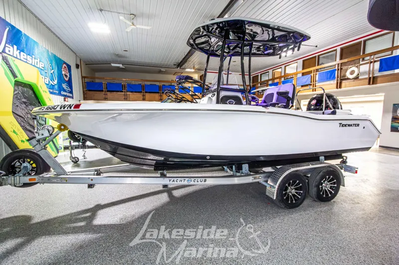 The Image of 2025 Tidewater 210 LXF boat on trailer at Lakeside Marina showroom. - 1