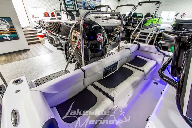 Slide: The Image of 2025 Tidewater 210 LXF boat interior with seating and motor at Lakeside Marina. - 11