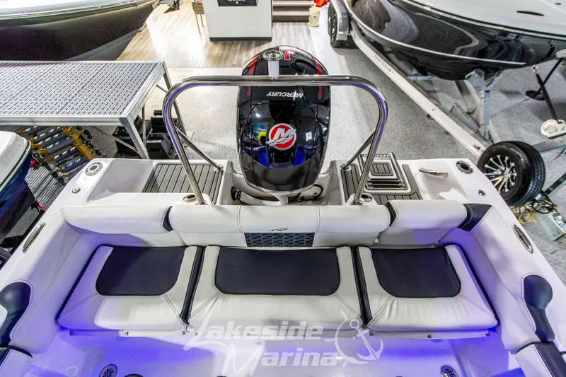 Slide: The Image of 2025 Tidewater 210 LXF boat interior with Mercury engine at Lakeside Marina showroom. - 14