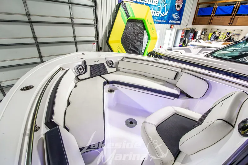Slide: The Image of 2025 Tidewater 210 LXF boat interior with cushioned seating and modern design. - 38