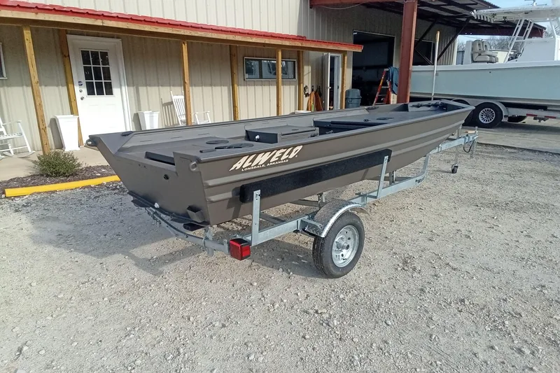 Slide: The Image of 2021 Alweld 1548VV Marsh RD Tiller boat on trailer outside a building. - 12