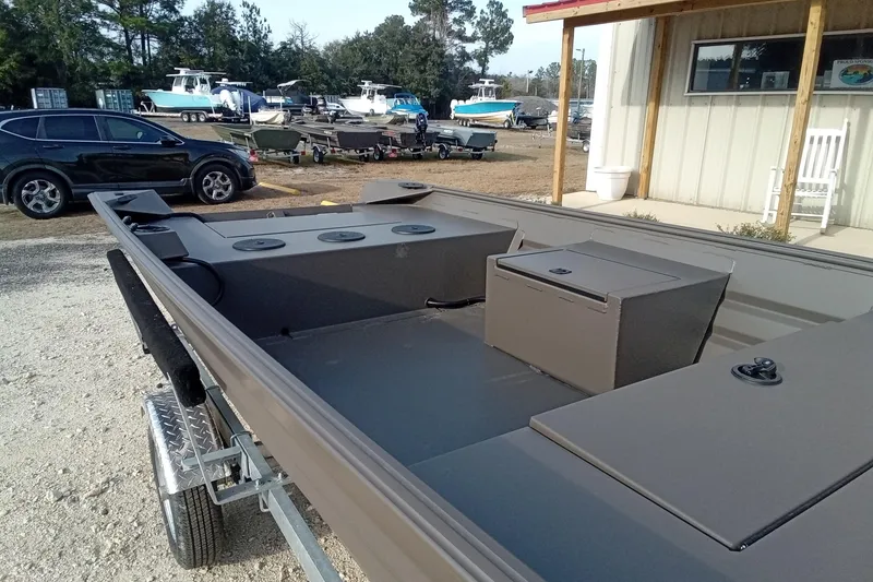 Slide: The Image of 2021 Alweld 1548VV Marsh RD Tiller boat on trailer, parked outdoors. - 7