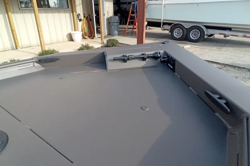 Slide: The Image of 2021 Alweld 1548VV Marsh RD Tiller boat interior, showcasing spacious deck and storage. - 8