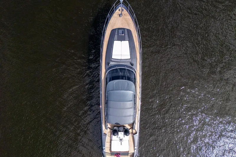Slide: The Image of Aerial view of 2015 Riva 63 yacht on calm water. - 18