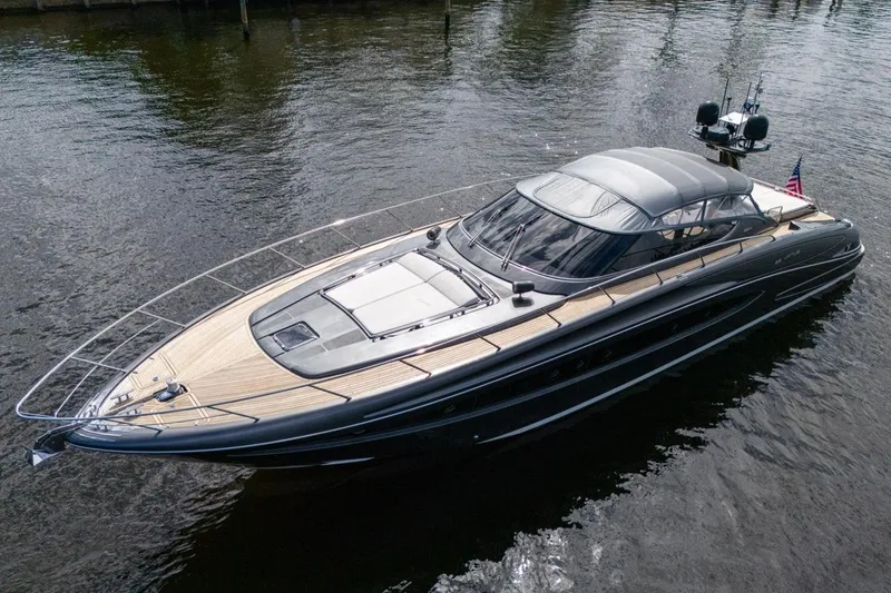 Slide: The Image of Luxurious 2015 Riva 63 yacht on calm water, showcasing sleek design and elegance. - 22