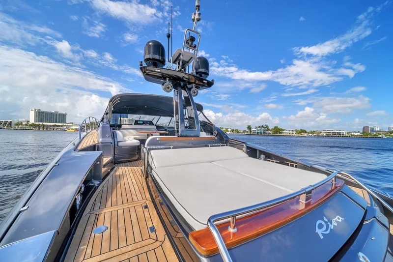 Slide: The Image of Luxurious 2015 Riva 63 yacht on calm waters under a clear blue sky. - 30