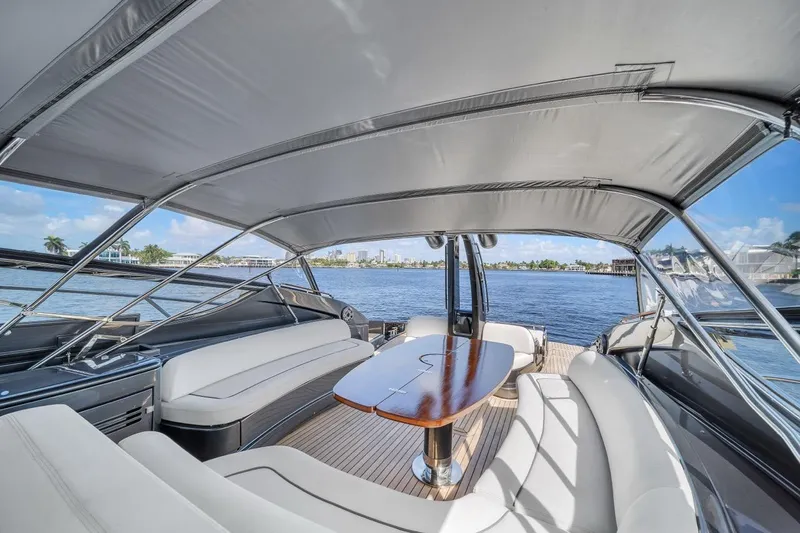 Slide: The Image of Luxurious 2015 Riva 63 yacht interior with elegant seating and scenic water view. - 39