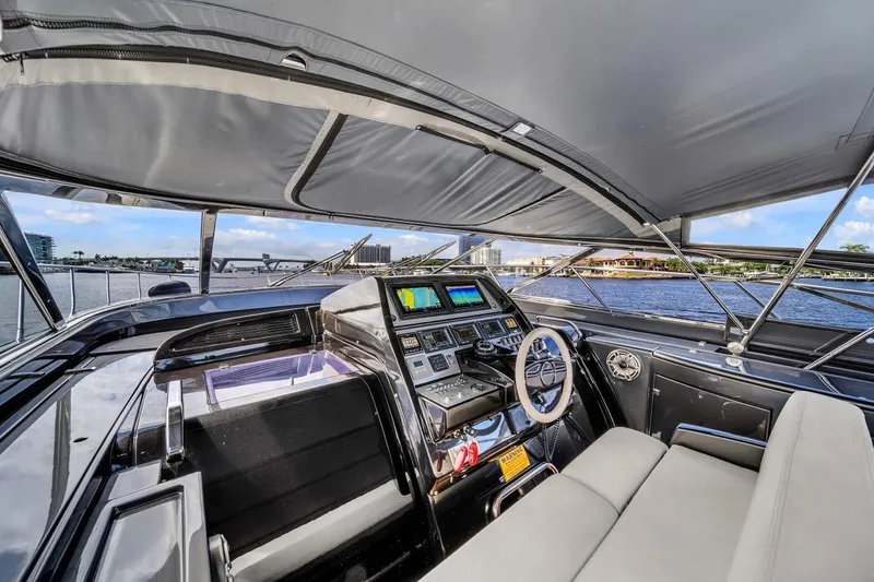Slide: The Image of Luxurious 2015 Riva 63 yacht cockpit with modern navigation system and waterfront view. - 44