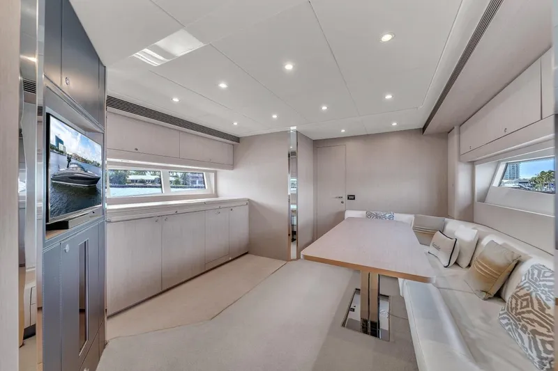 Slide: The Image of Luxurious interior of a 2015 Riva 63 yacht with modern seating and elegant decor. - 47