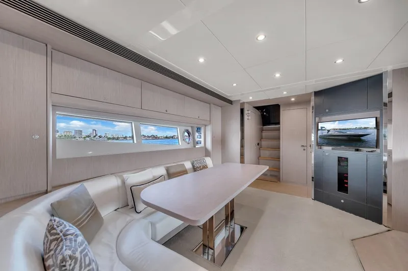 Slide: The Image of Luxurious interior of 2015 Riva 63 yacht with modern seating and scenic windows. - 49