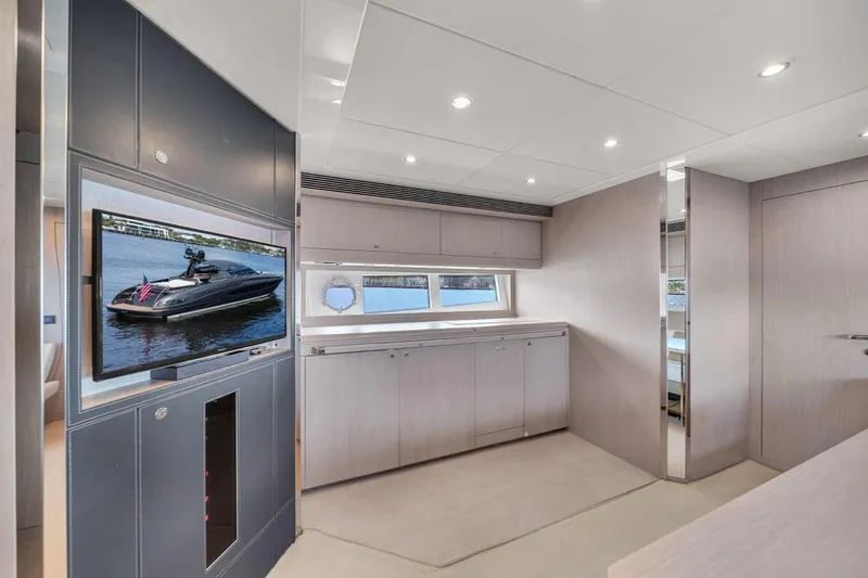 Slide: The Image of Luxurious interior of 2015 Riva 63 yacht with modern design and large TV display. - 51