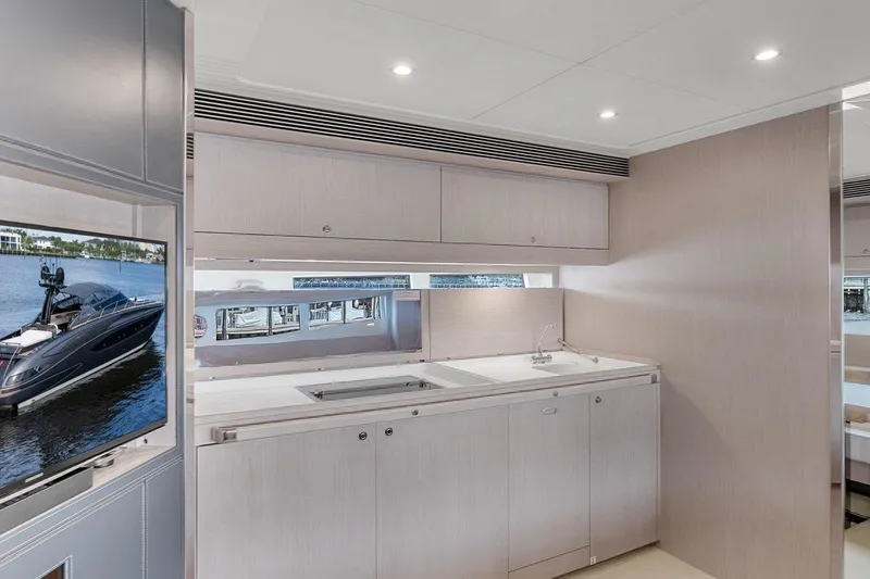Slide: The Image of Luxurious interior of 2015 Riva 63 yacht with modern kitchen and sleek design. - 52