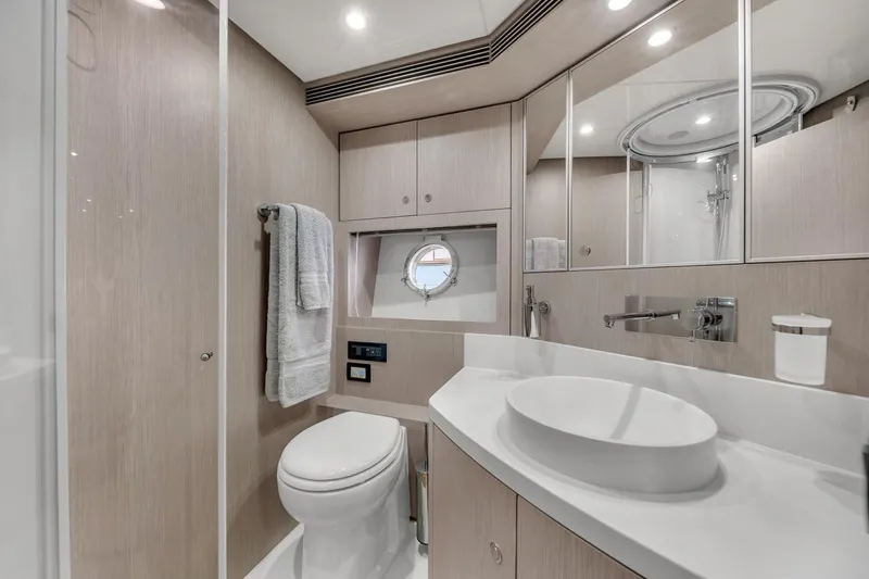 Slide: The Image of Luxurious bathroom in 2015 Riva 63 yacht with modern fixtures and elegant design. - 56