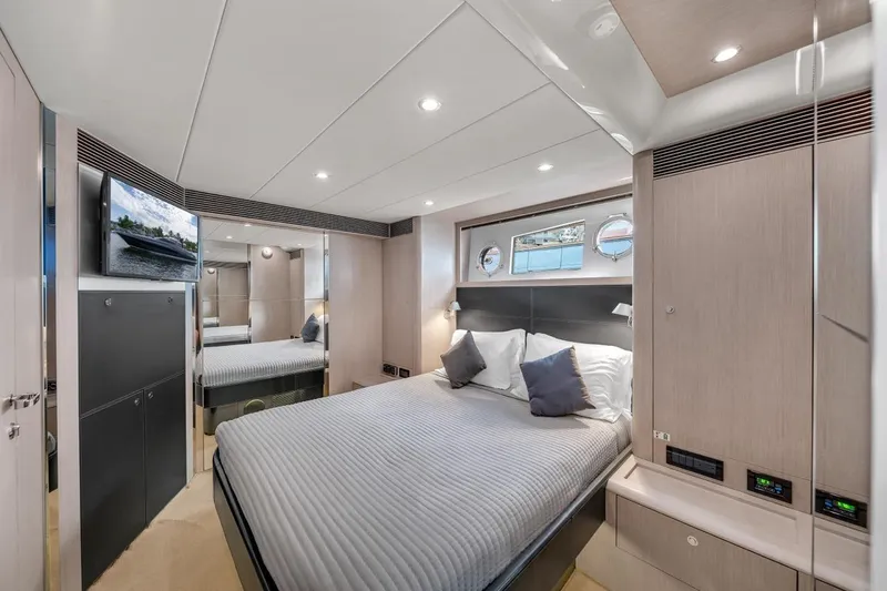 Slide: The Image of Luxurious interior of 2015 Riva 63 yacht bedroom with modern design and cozy ambiance. - 58