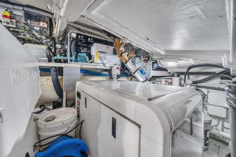 Slide: The Image of Engine room of a 2015 Riva 63 yacht, showcasing machinery and equipment. - 69
