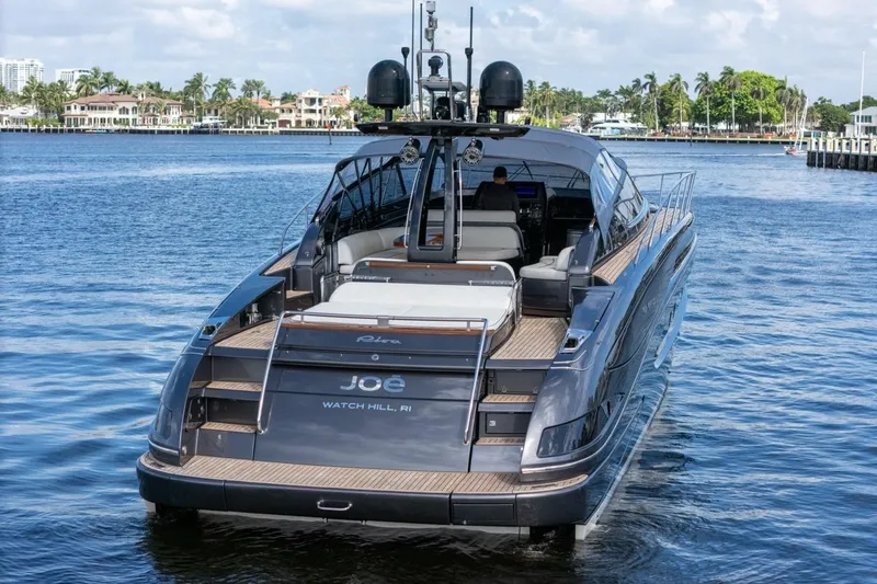 Slide: The Image of Luxury 2015 Riva 63 yacht on serene water, showcasing elegant design and craftsmanship. - 8