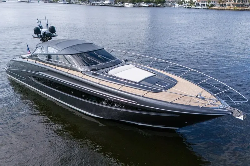 Slide: The Image of Luxurious 2015 Riva 63 yacht on calm waters, showcasing sleek design and elegance. - 17