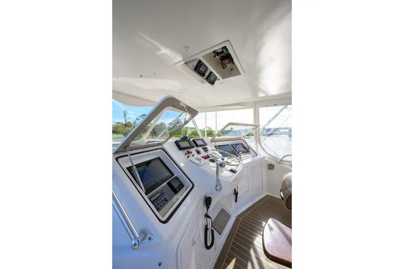 Slide: The Image of Helm of 2006 Ocean Yachts 57 Super Sport with advanced navigation equipment. - 25